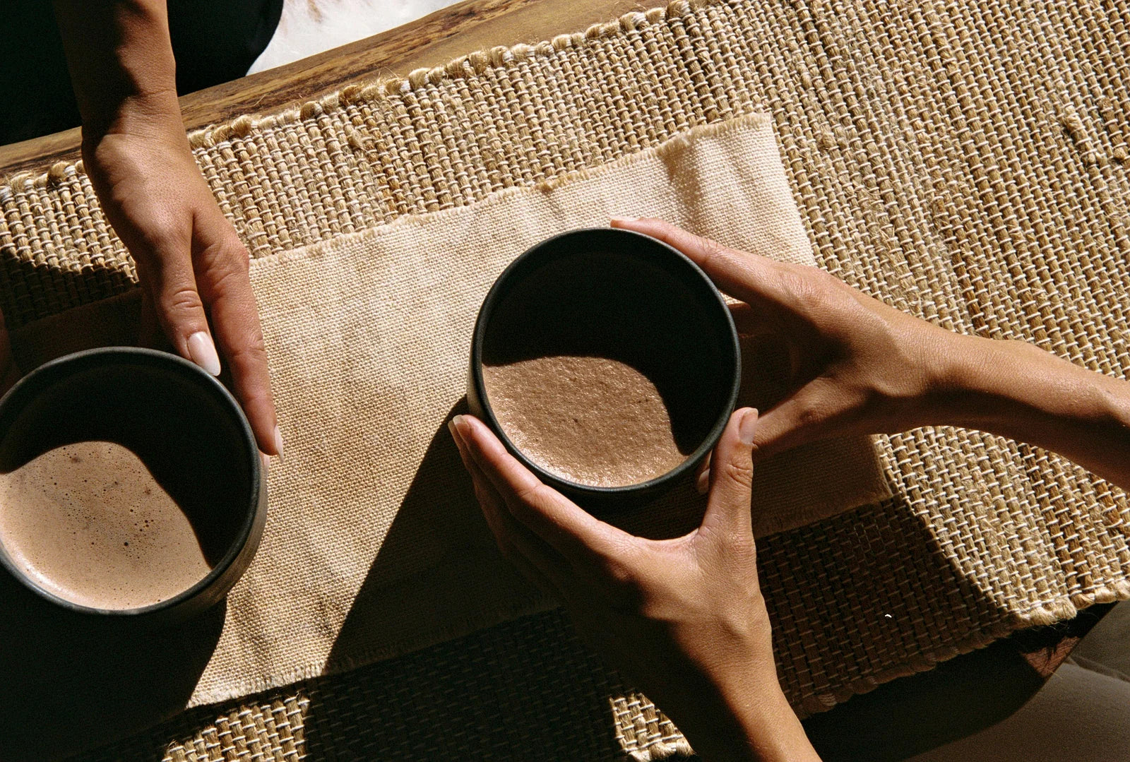 Close-up of broken ceremonial cacao paste and dark cacao powder
